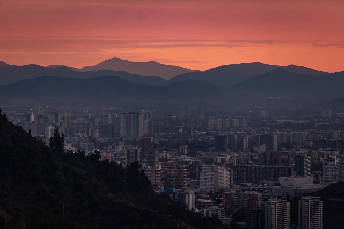 Santiago's skyline and the Andes mountains at dusk